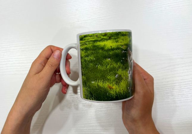 Unboxing of a personalized white mug with a photo