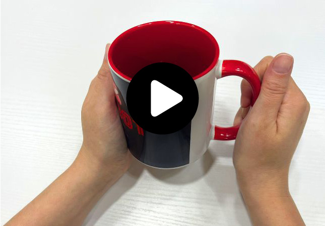 Unboxing a personalized gift: a red mug from Workcenter